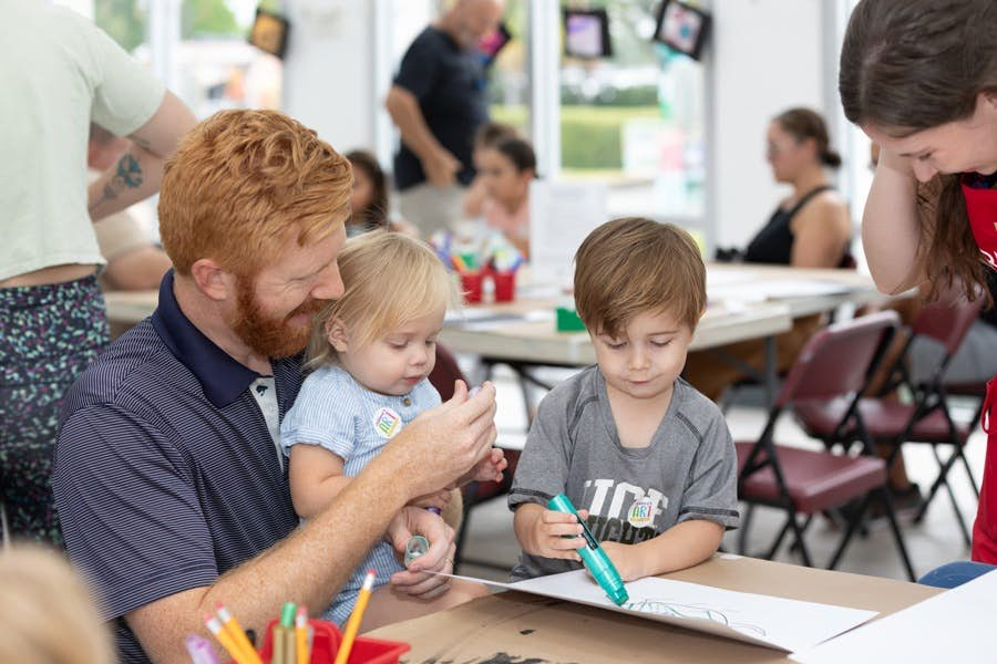 dad and kids doing crafts